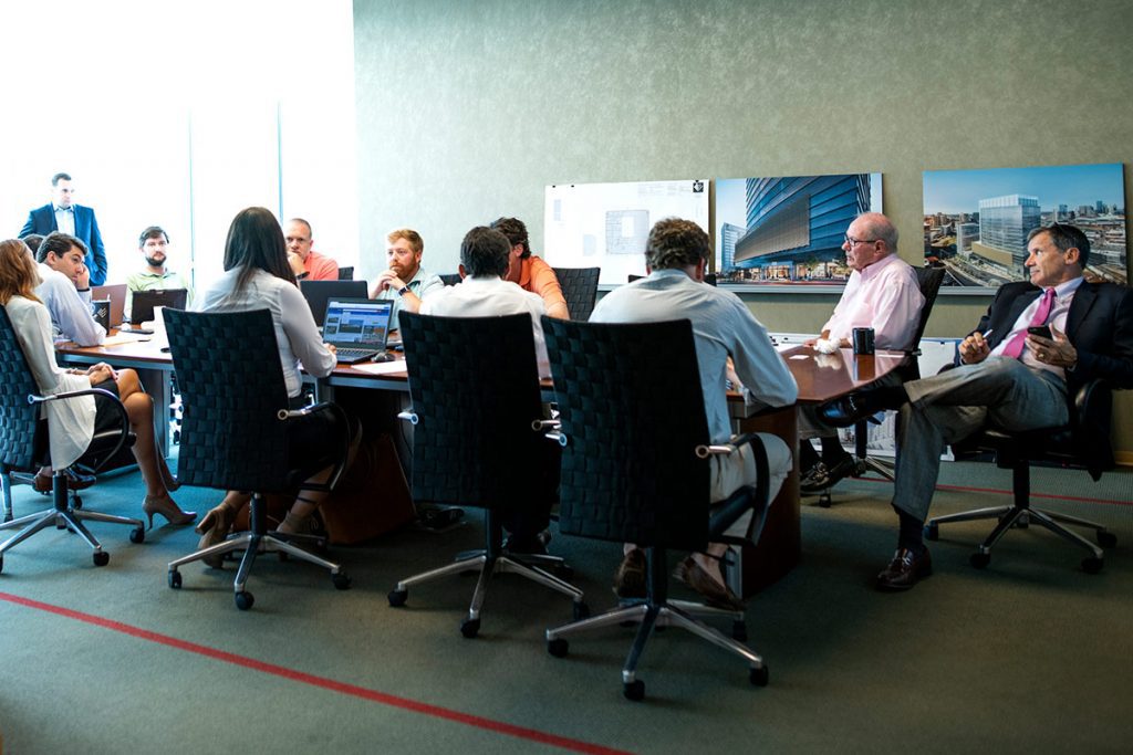 southeast-venture-home-our-team the brokerage department gathers for a team meeting